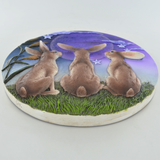 Three Moongazing Hares On Hilltop With Night Sky On Plaque