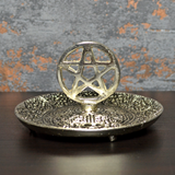 Silver coloured metal incense plate featuring a pentagram symbol